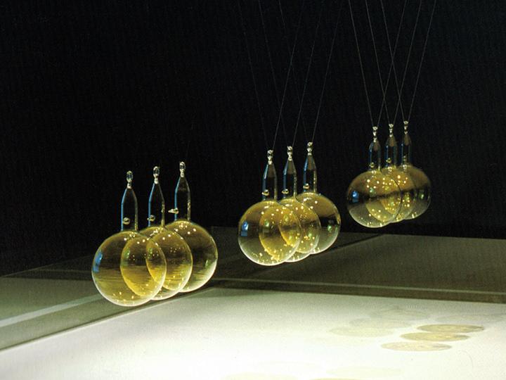 Glass pendulumns floating on wires
