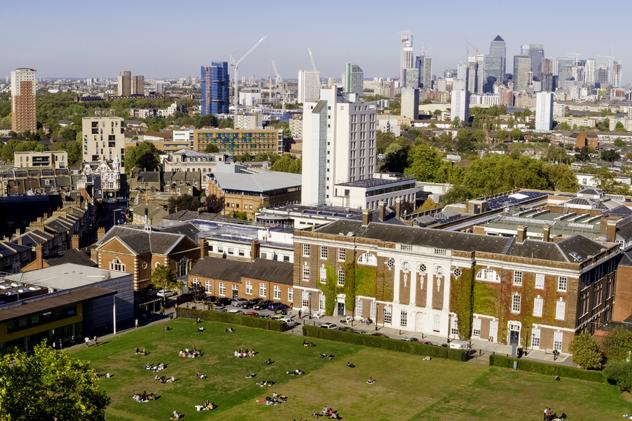 An aerial view of the Goldsmiths campus, with the College Green in the foreground and the back of the redbrick Richard Hoggart Building in the background
