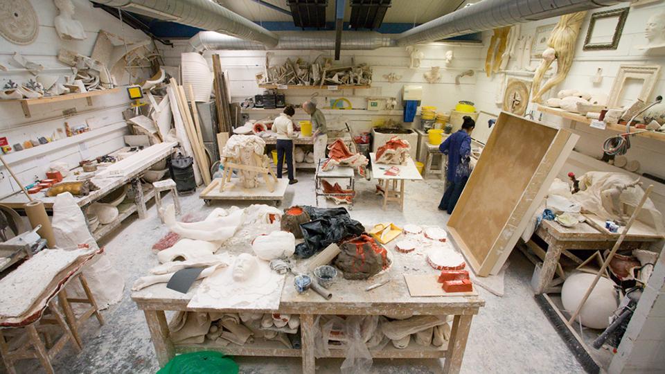 A wide shot of the casting practice area, including work benches