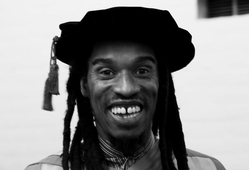 Benjamin Zephaniah smiling at a graduation ceremony, wearing a mortar board 