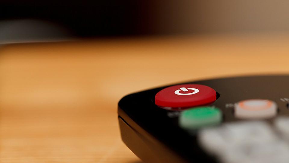 A close up image of a TV button with the off button visible