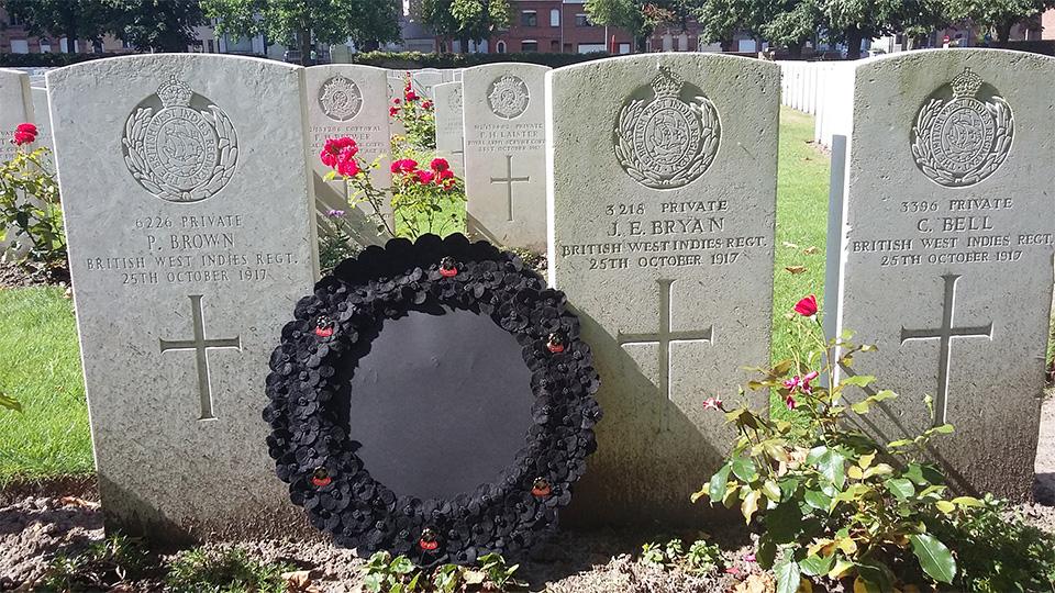 BlackPoppyRose wreath laying on graves