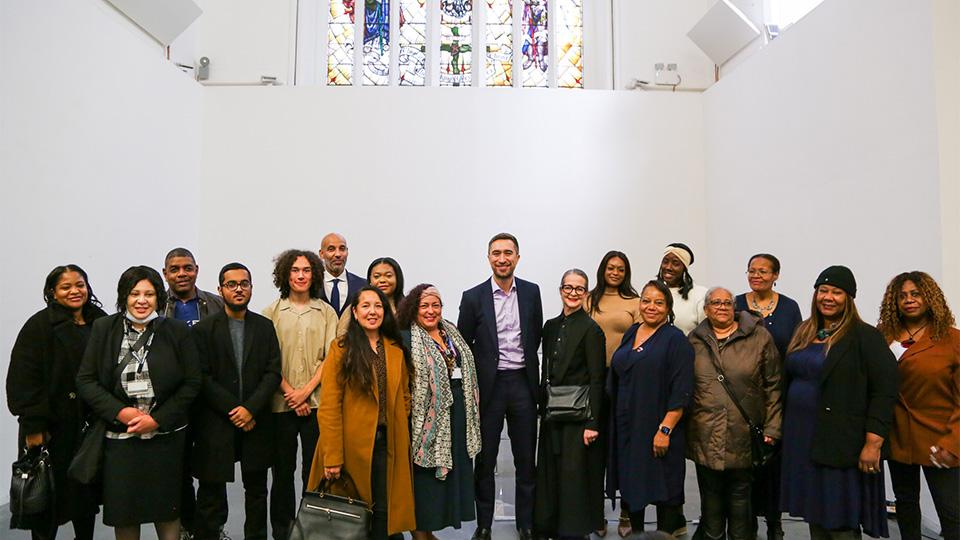Recipients of the New Cross Fire Bursaries with Professor Frances Corner, Damien Egan, New Cross Fire survivors and family members of the vicitms