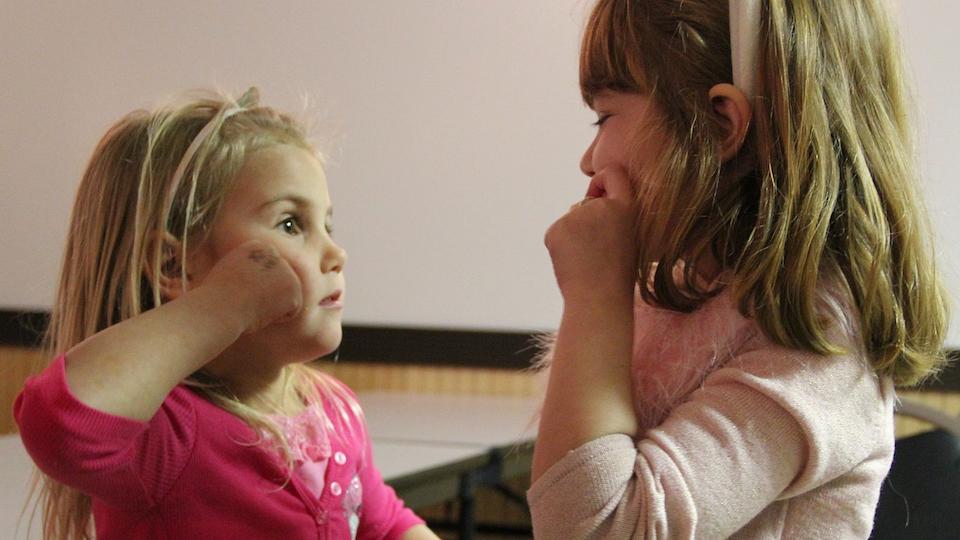 girls learning sign language