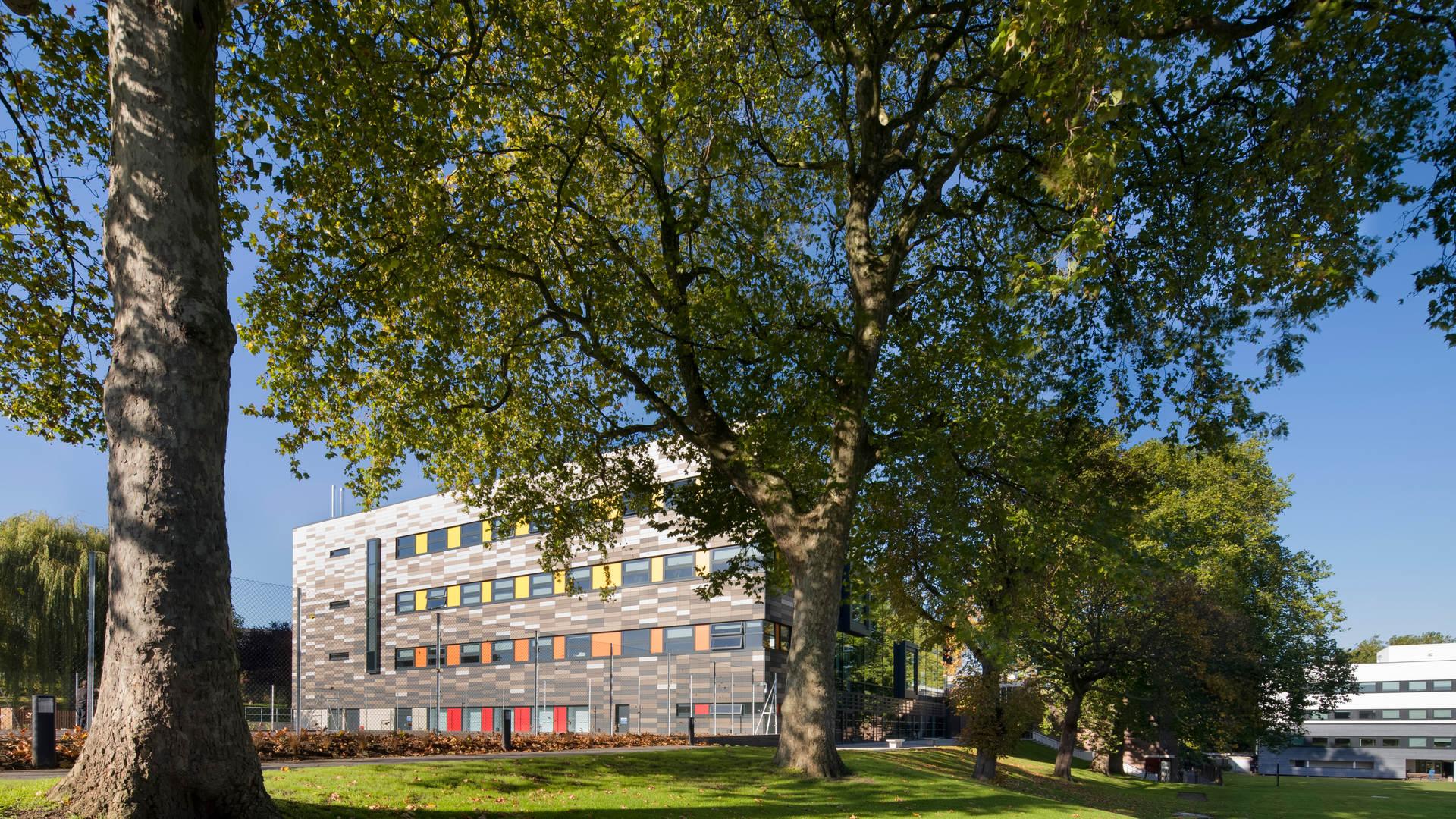 Stuart Hall Building covered by trees