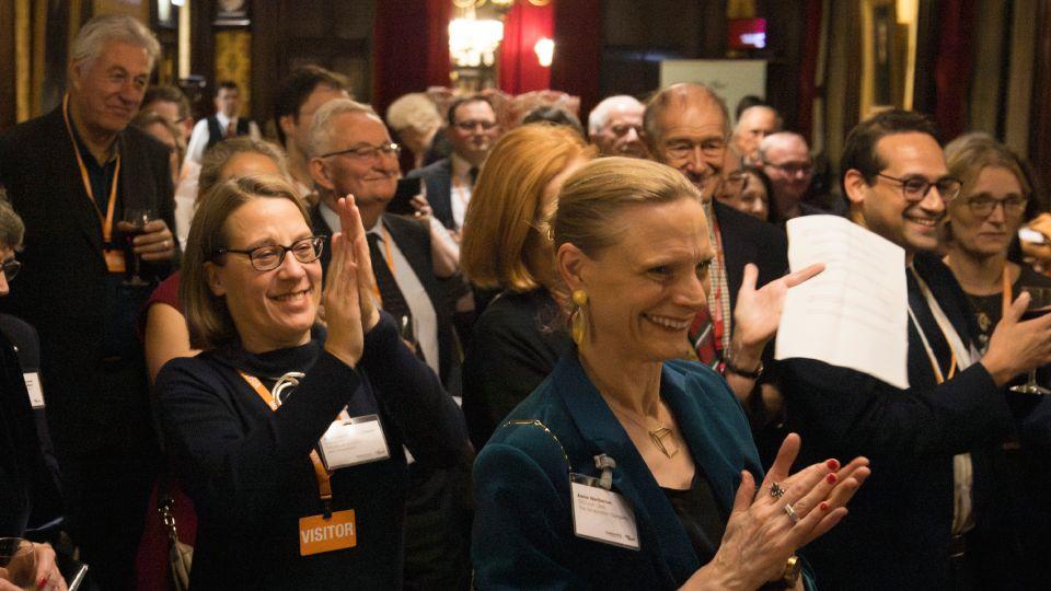 Group of supporters applaud 