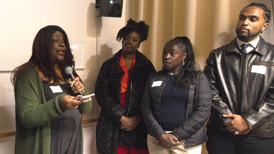 Female academic (left) introduces male student (right)