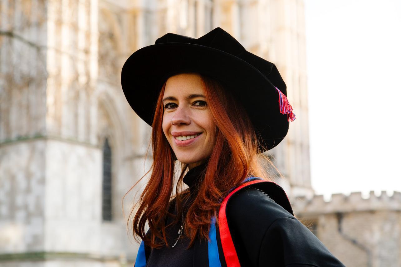 Kalki Koechlin wearing a gown and mortar board, smiling as she was made an Honorary Fellow in 2025
