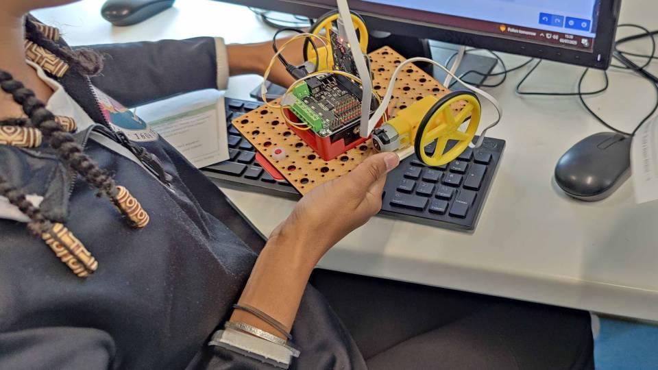 Close-up image of robot in the hands of a year 7 pupil