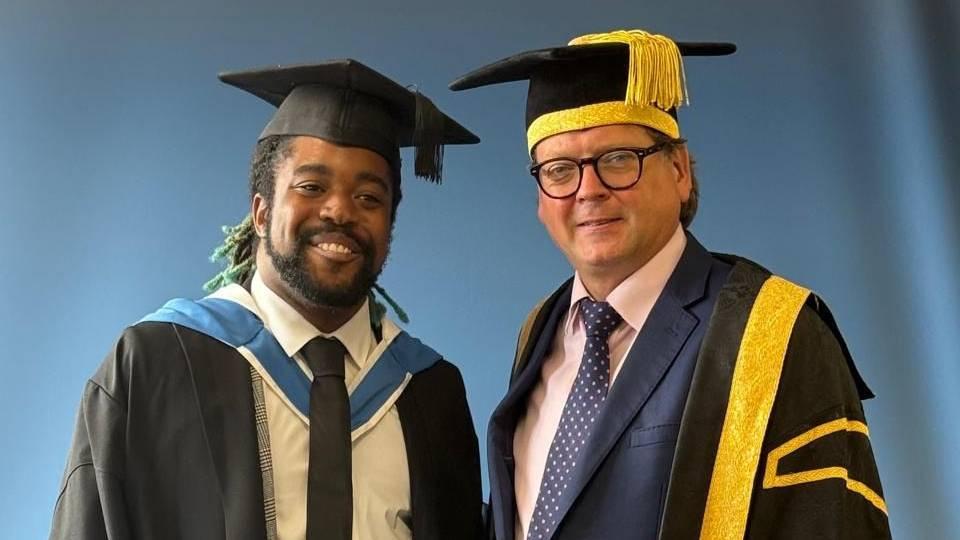 One undergraduate (gowned) with action Chair of Council, in robes.