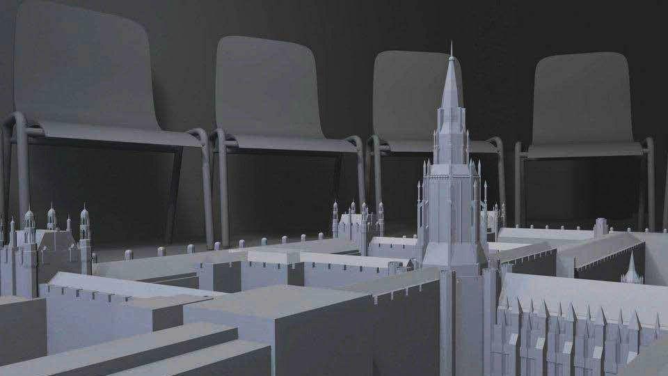 Installation depicting the Houses of Parliament with classroom chairs circling it. 