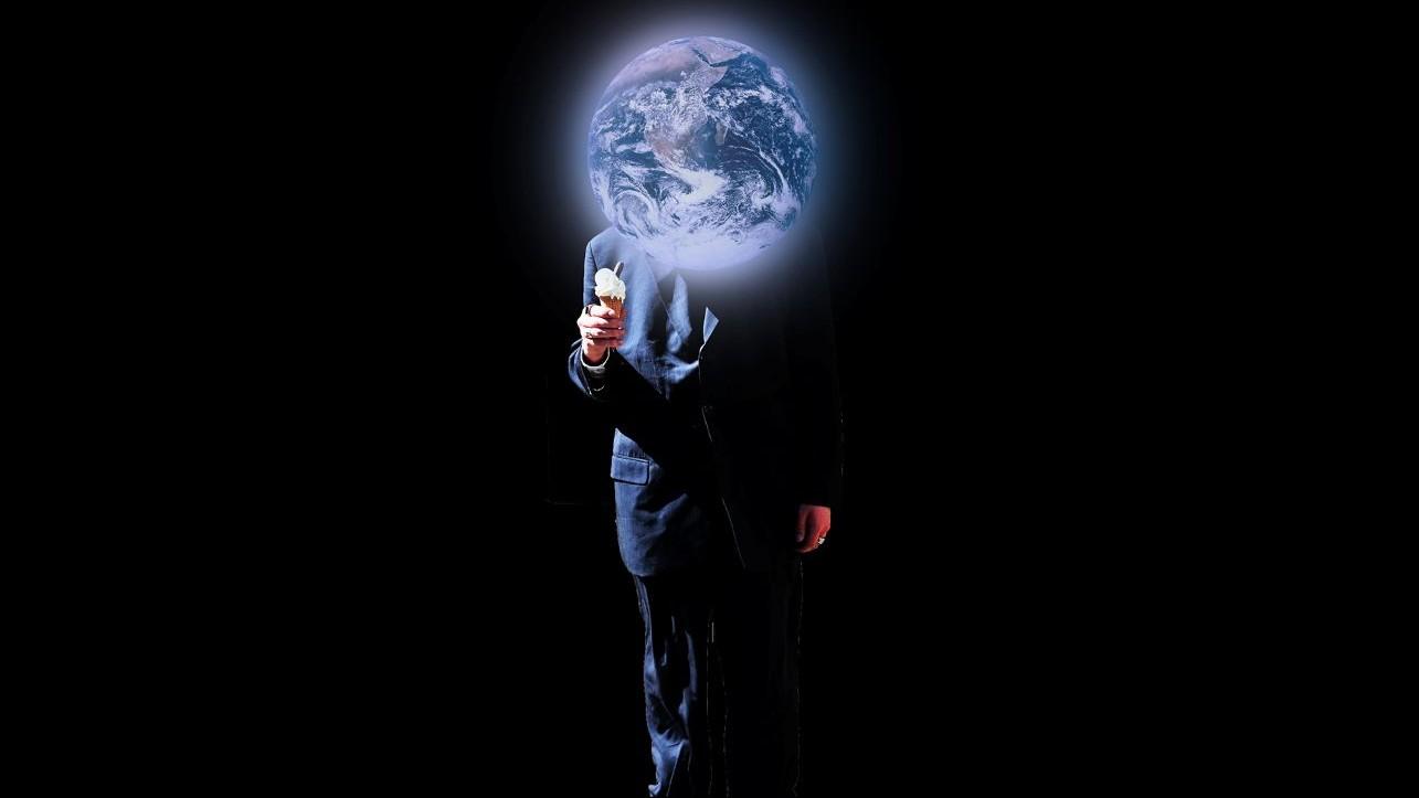 A black background, with a man wearing a suit, in place of a head there is an image of the Earth. 
