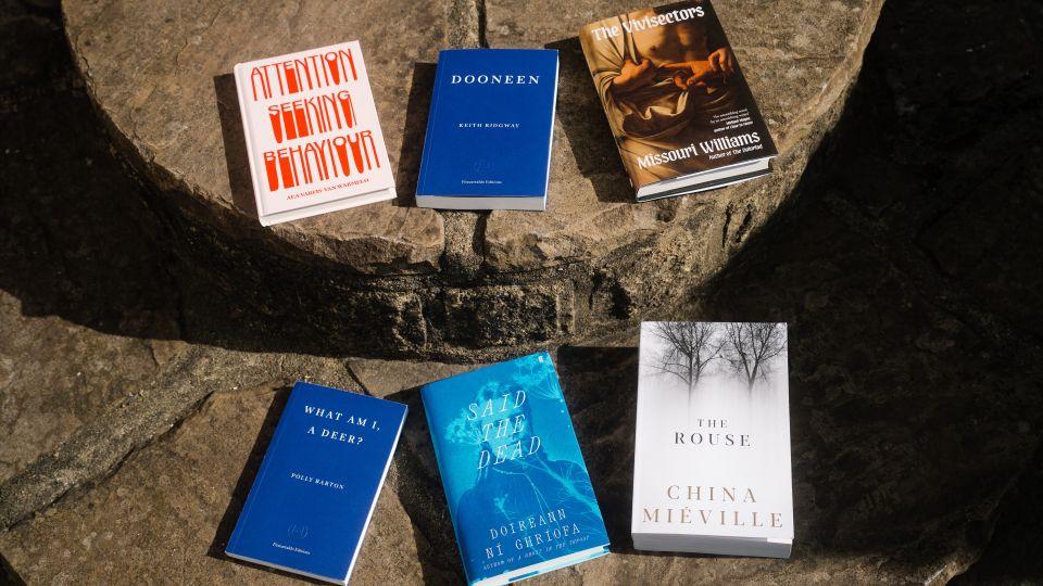 The six shortlisted books laid out in two rows of three on some stone steps