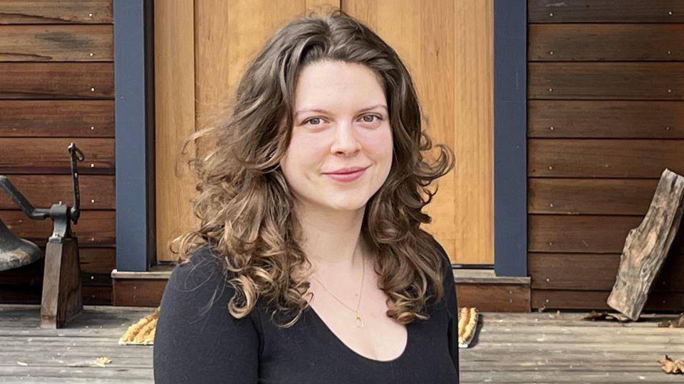 A portrait of Sophie García Halliday wearing a black top
