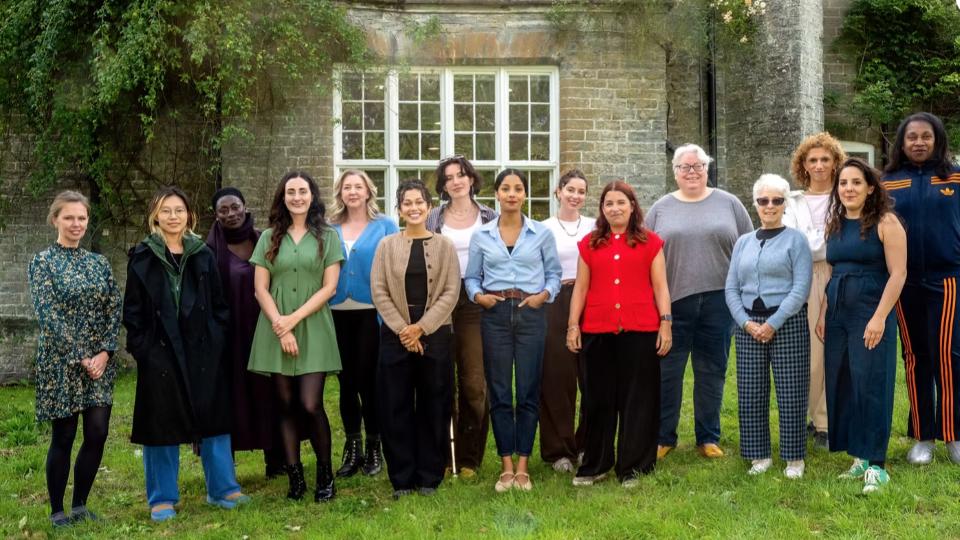 The cohort of women taking part in the screenwriters' lab stood outside an old building