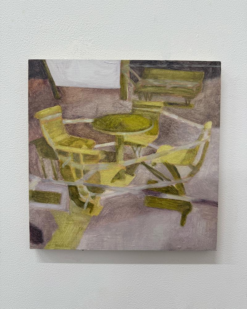 A painting of a yellow table and chairs