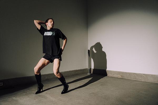 A man dancing in high heels