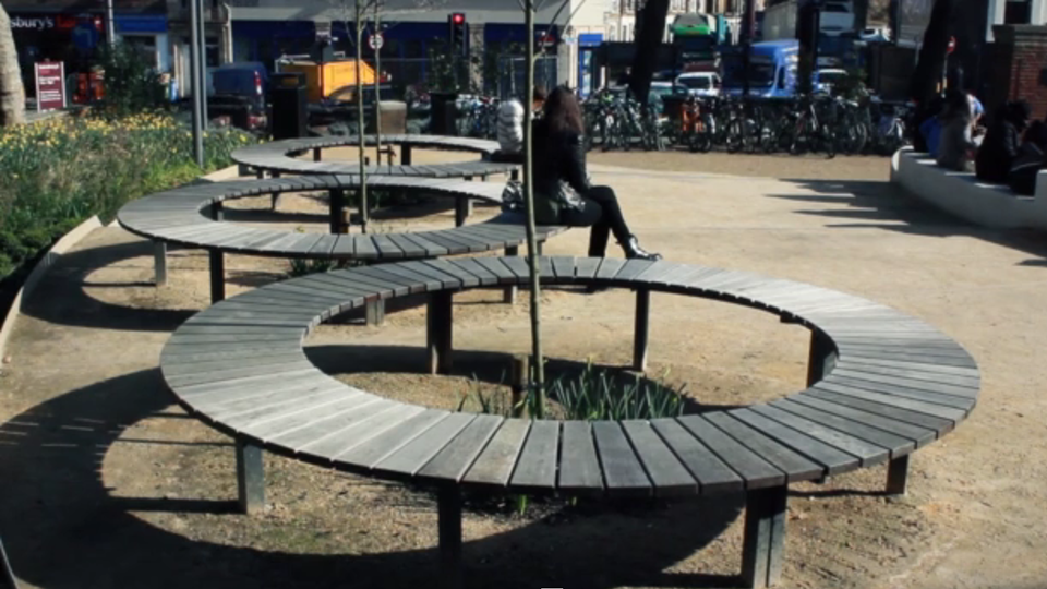 A public space with large sculptural benches.