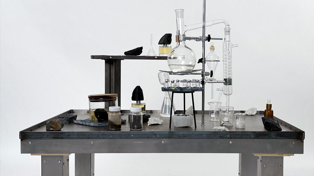 A metal table with perfume making equipment 