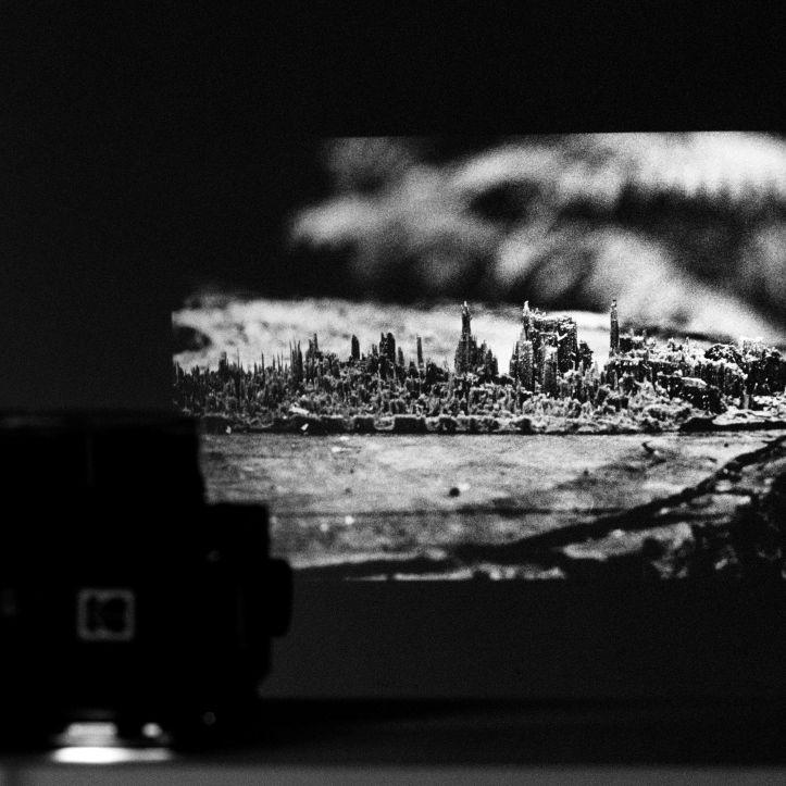 A slide projector projecting a black and white photography