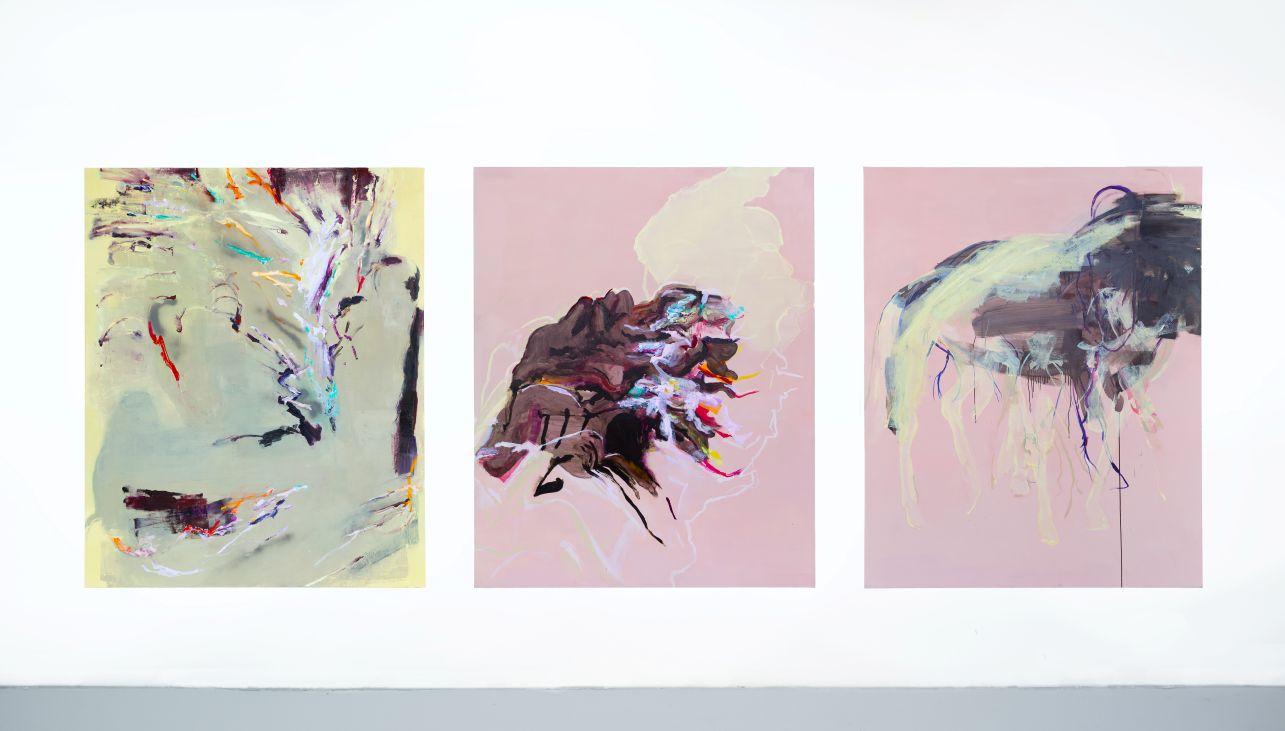 Three abstract canvases with outlines of figures, pale yellow and pink colours feature prominently. 