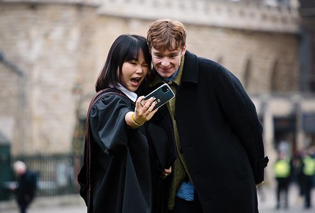 Two graduates taking a selfie