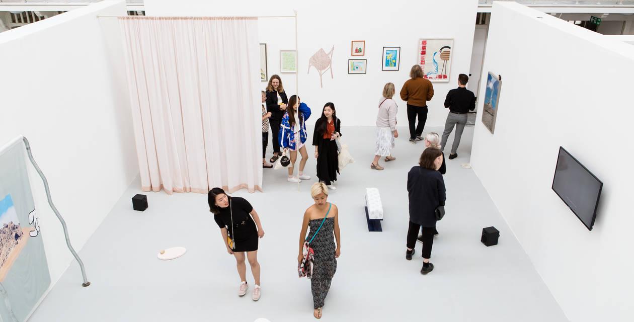 People in an exhibition space