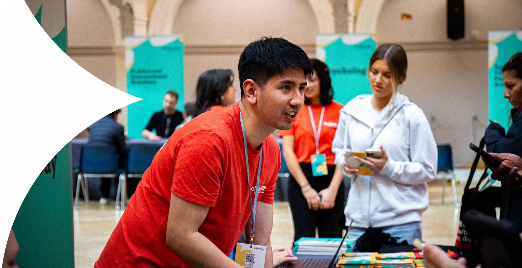 A student offering help in the Great Hall