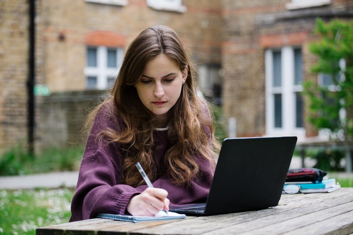 Student working at a laptop.