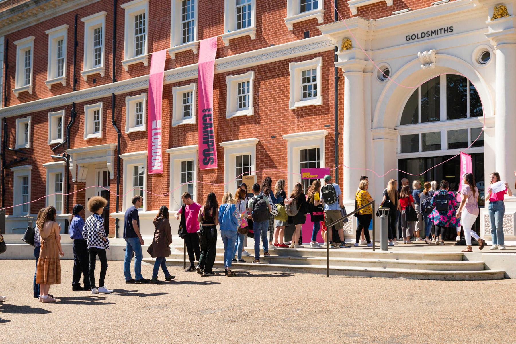 Prospective students queueing outside the Richard Hoggart Building to attend an open day.
