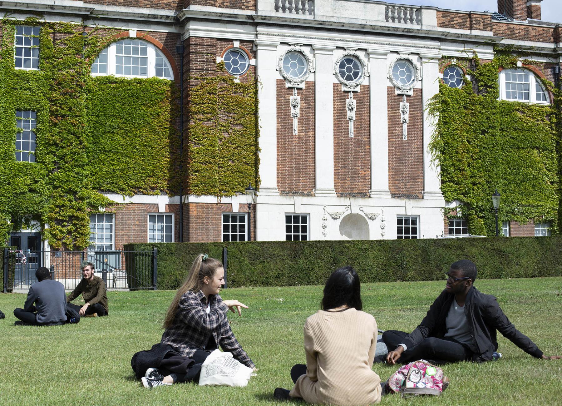 Students sitting on the college green