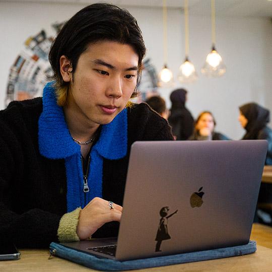 Student looking at a laptop