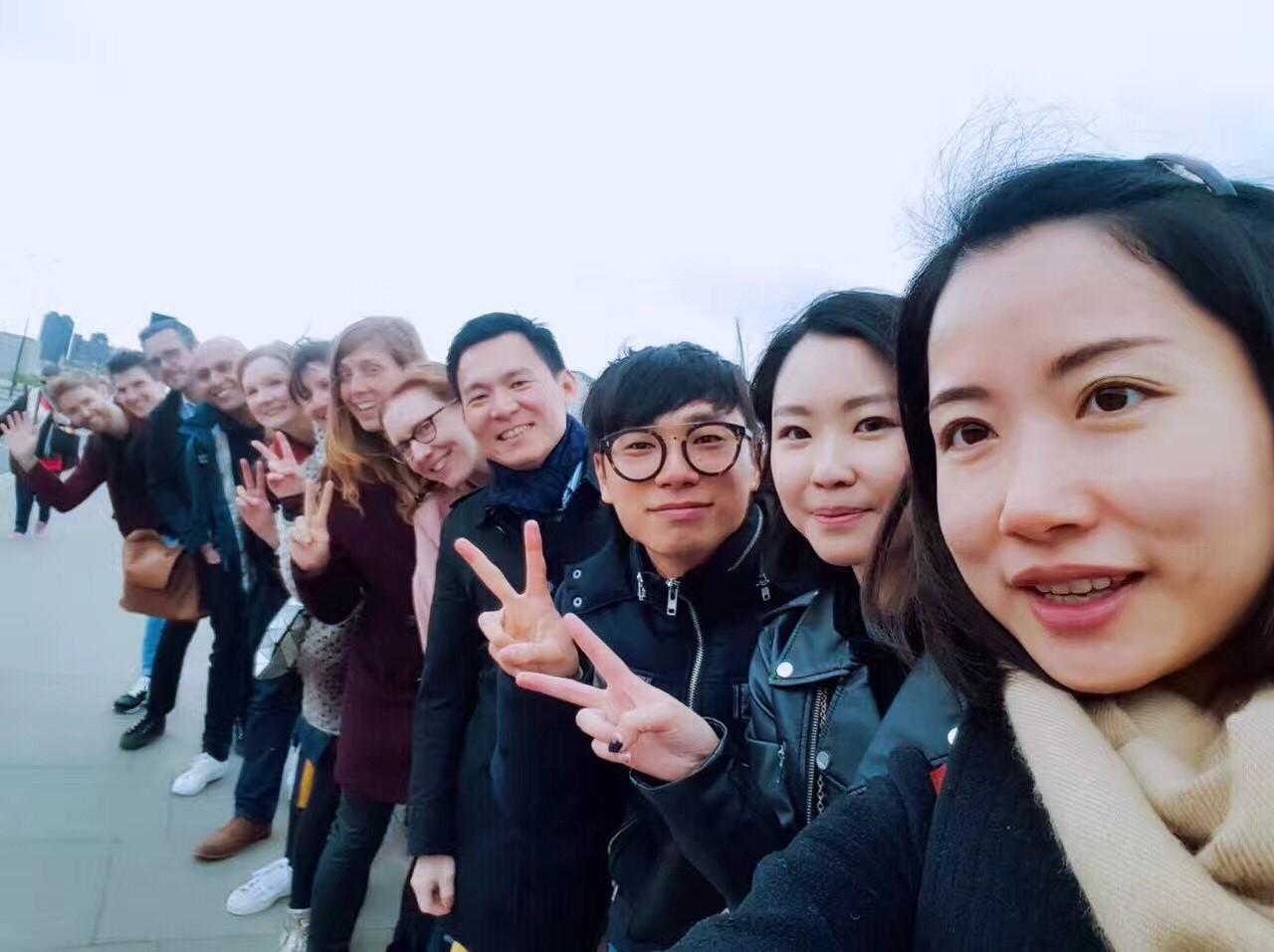 The international team stands in front of the Richard Hoggart Building at Goldsmiths
