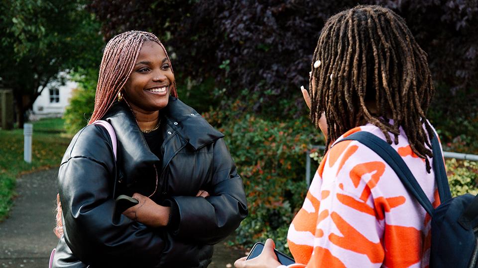Two female students talking outside